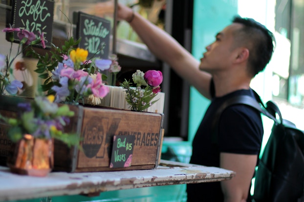  Customer purchasing flowers from Uprooted Flower Truck.