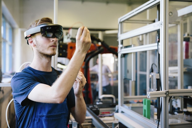  Man uses VR at work.