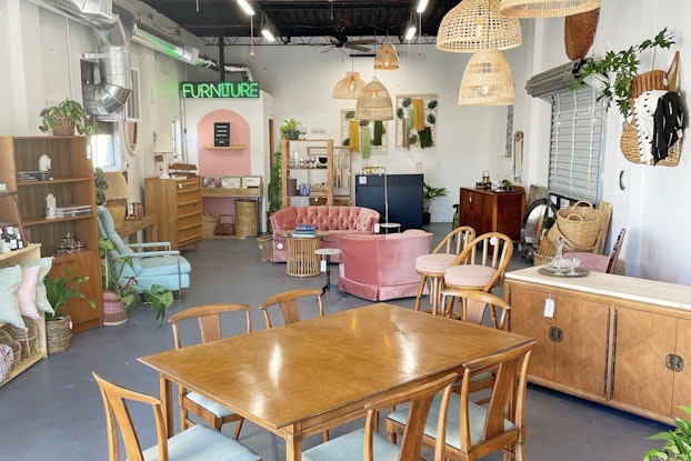  An antique store displays eclectic furniture and decor