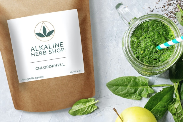 Bag of Alkaline Herb Shop herbs displayed with leaves and greens.