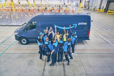 amazon employees in front of van