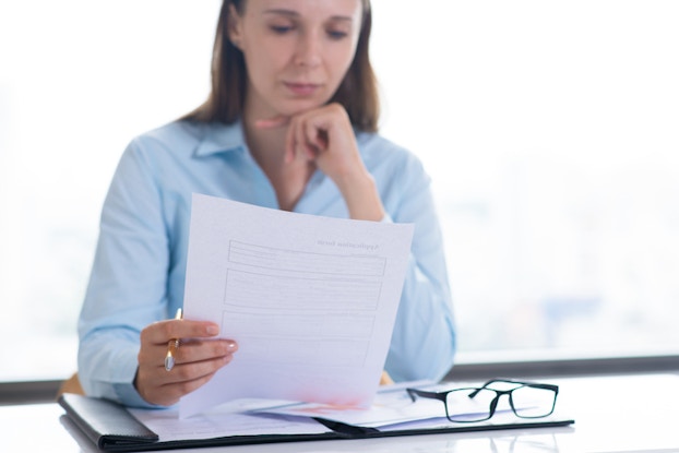 professional woman looking over a document
