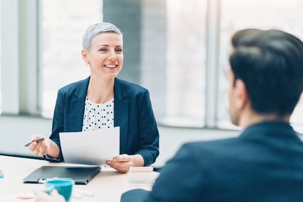  woman interviewing a man