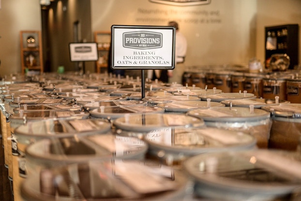 Interior of BD Provisions store in Connecticut, with various canisters containing food ingredients.
