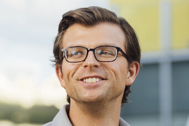 A headshot of Paul Cheek, the Executive Director of the Martin Trust Center for MIT Entrepreneurship, standing outside and looking off to one side.