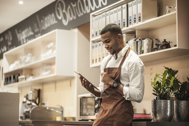 Black business owner in shop