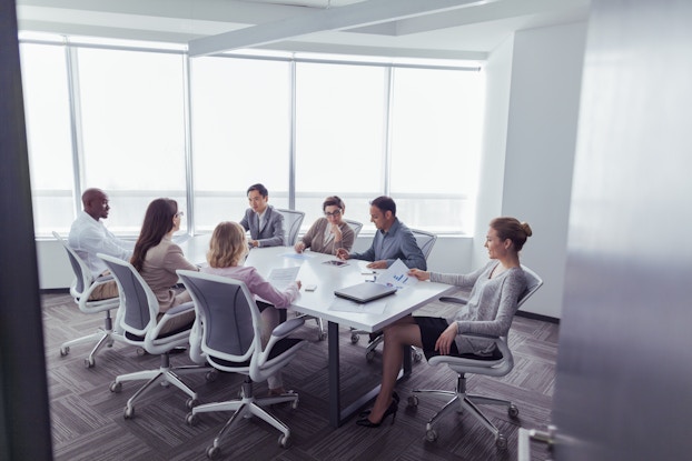 employees sitting in a board meeting