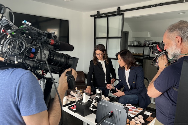  Bobbi Brown and her camera crew preparing products for a TikTok recording.