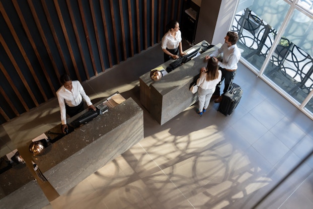  top view of couple checking into a hotel