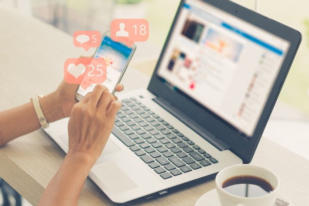  woman on social media on phone and laptop