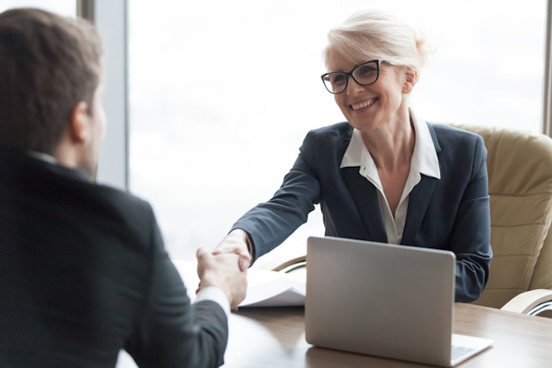 man meeting with woman at a bank