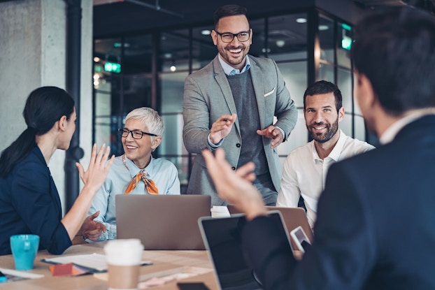  group of happy employees in a meeting