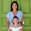 a woman and a girl posing for a picture