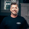 a man smiling at the camera