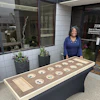a woman standing next to a table