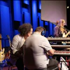 a group of people playing instruments on a stage
