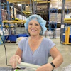 a woman in a blue hair net