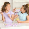 two girls playing with make up