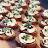 a group of food on a wooden board