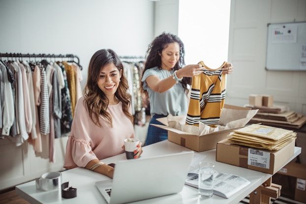 two women working together