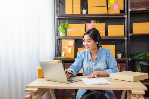 woman working on laptop at home