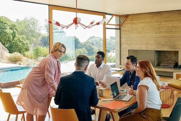  coworkers having a meeting in a house