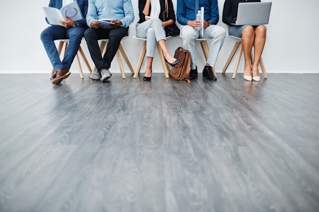 Workers sitting waiting for an interview