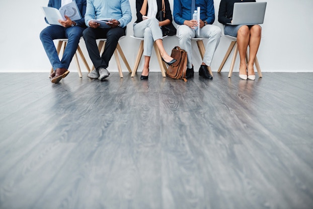  Workers sitting waiting for an interview