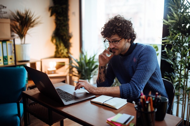 Man working on laptop computer