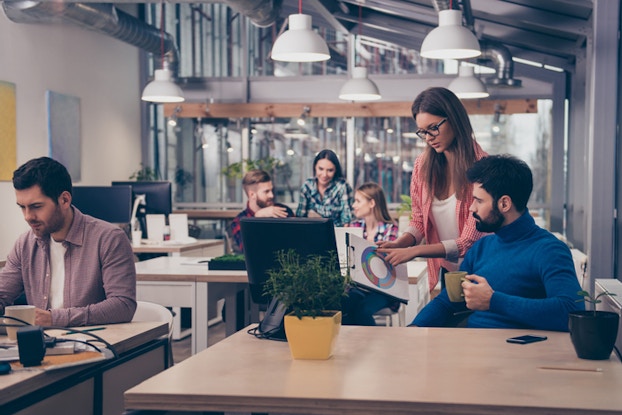 Co-workers in office space