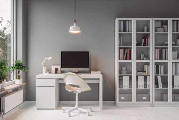  Modern home office with white furniture.