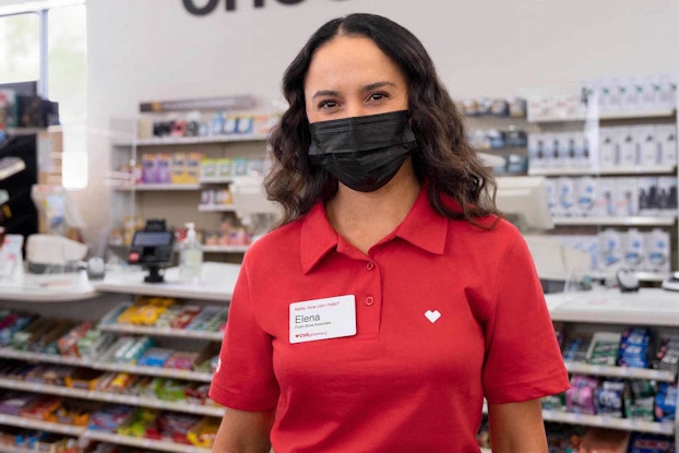 CVS Health employee working in the store with a mask on.