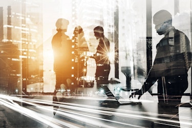 Futuristic view of employees in an office in a metropolitan area.