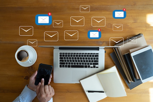 Person answering emails on phone