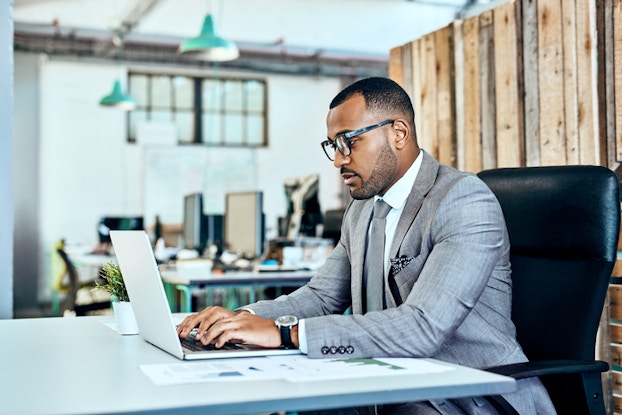  Man working at laptop