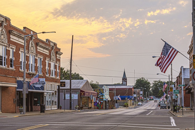 Main Street in America lined with flags.