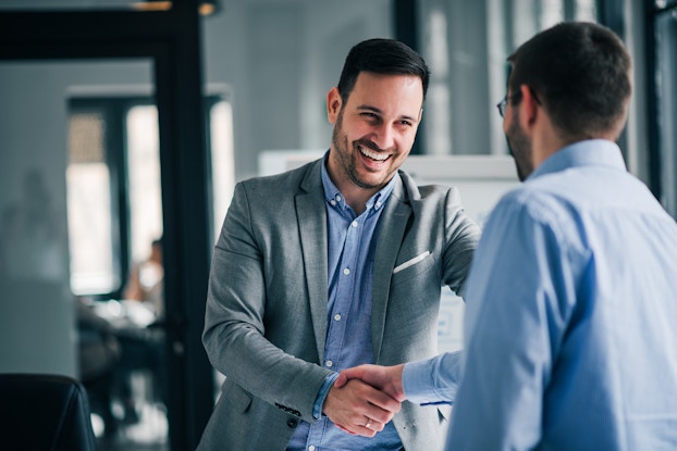  two men shaking hands