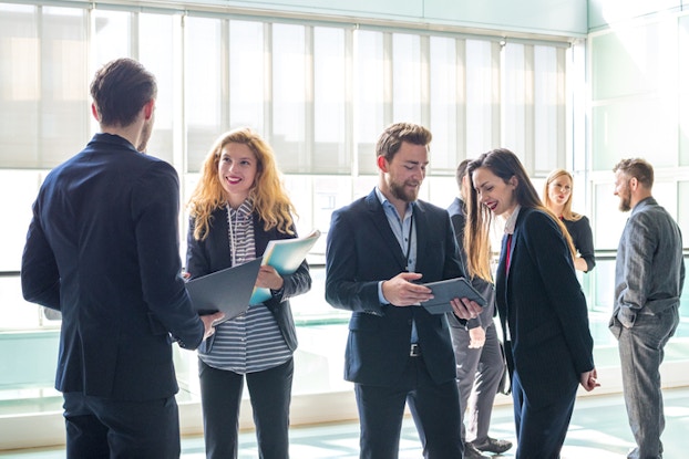  a group of professionals at a networking event