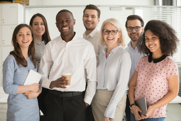  group of employees standing in group