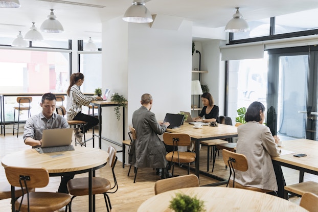  Workers sitting in co-working space