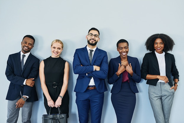  diverse employees standing in a row