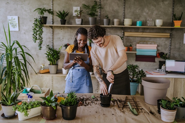 two florists using tablet