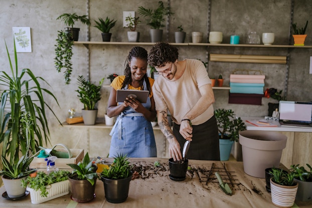  two florists using tablet