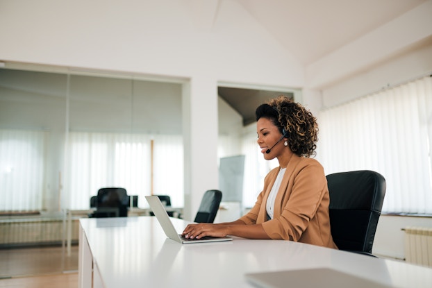  woman on laptop alone in office