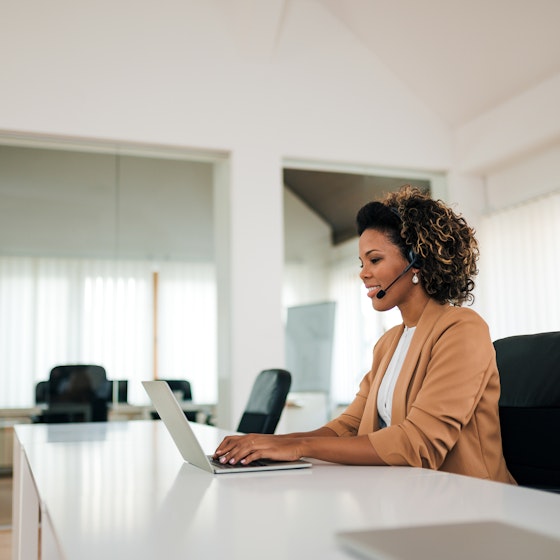 woman on laptop alone in office