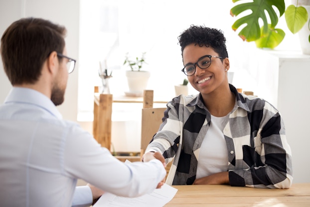man and woman in an interview