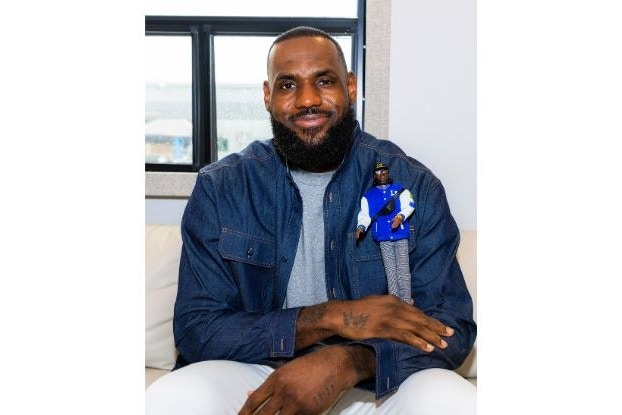 LeBron James holding his doll by Mattel.