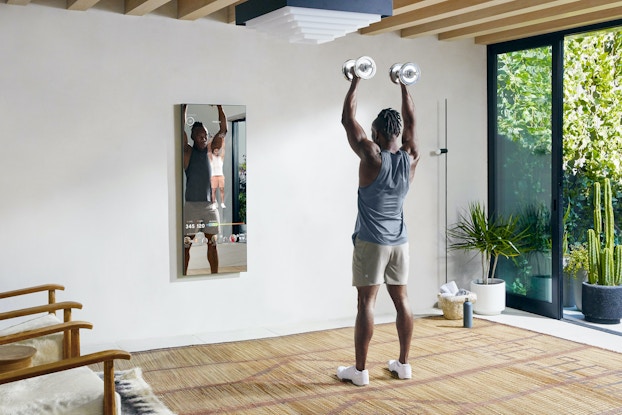  man working out in house with Mirror