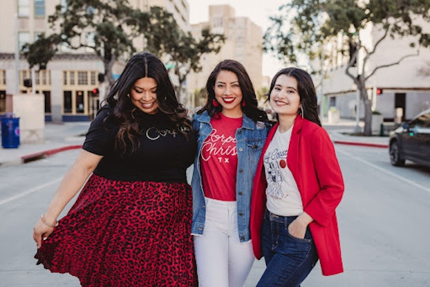 Three models standing outside wearing items from retail gift shop Made in Corpus Christi.