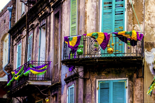  New Orleans building decked out in colorful Mardi Gras decorations.